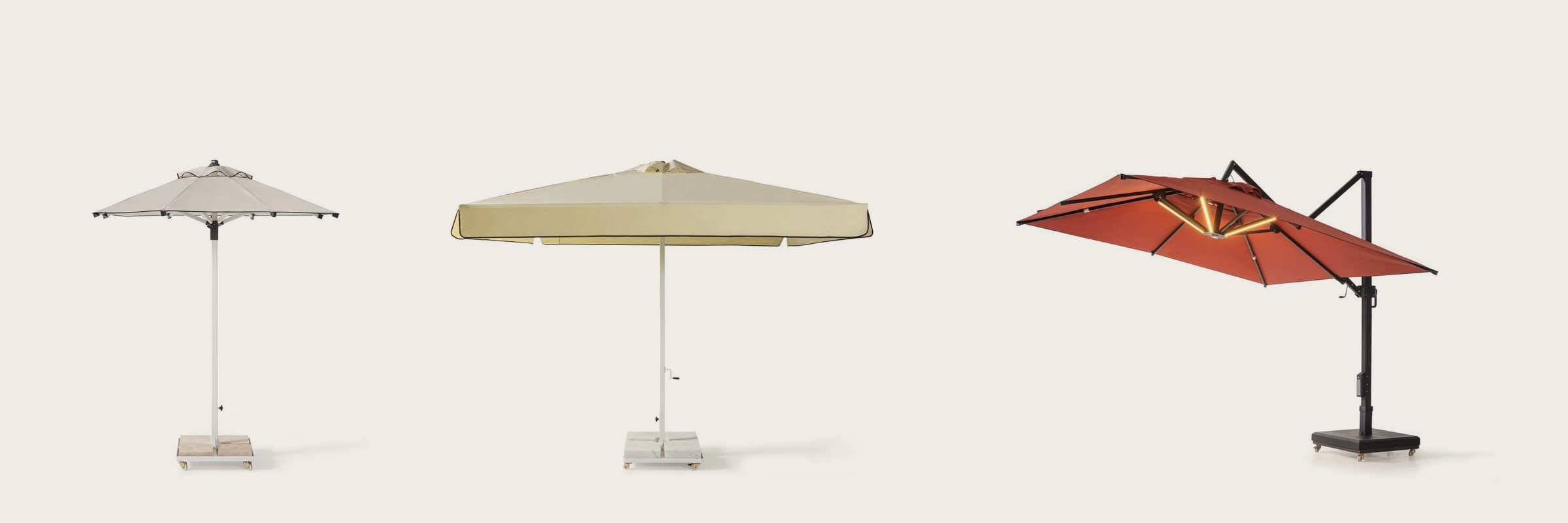 Two centre-post parasols and a cantilever parasol